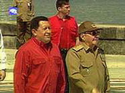 Venezuelan President Hugo Chavez Salutes Raul Castro.